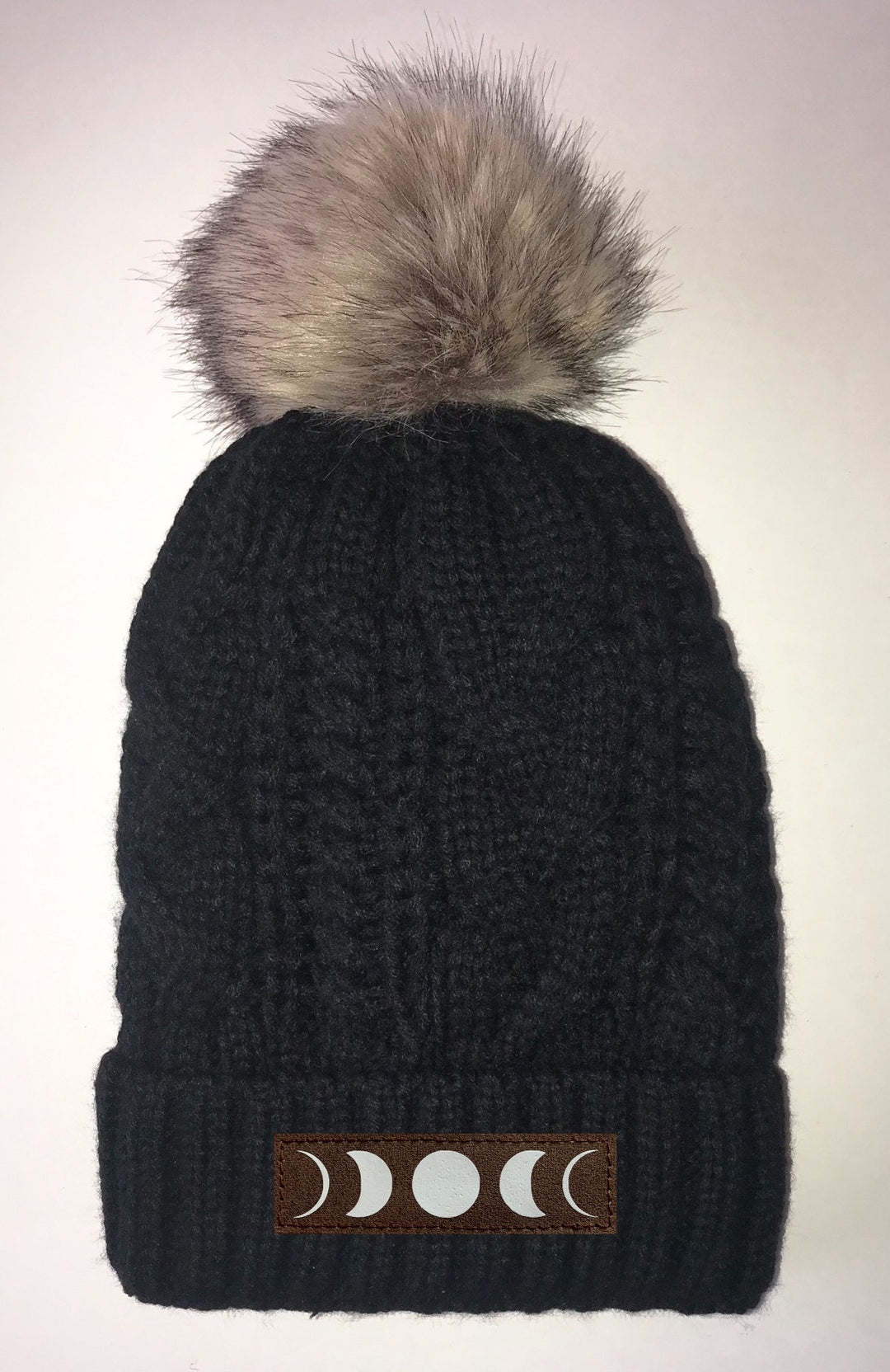 Buddha Gear Black, Cable Knit, Blanket Lined Pom Pom Beanie with Moons, Namaste, Infinite Love, Unicorn, Tree of Life, Coffee, Om, Cannabis, Utah Mountains, Ganesha, Om, Eye of Horus, Heavily Meditated. All patches are Vegan and Hand Made Yoga Clothing