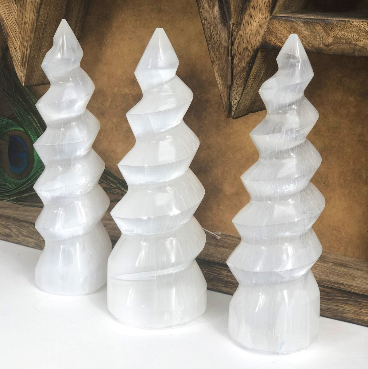 Selenite protects and shields a person or space from outside influences. Selenite is a crystallized form of Gypsum, which is used for good luck and protection. The powerful vibration of Selenite can clear, open, and activate the Crown and Higher Chakras and is excellent for all types of spiritual work. It's also excellent for clearing your aura and other crystals. Buddha Gear
